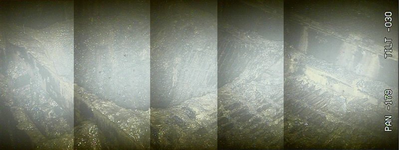 1月30日の調査でカメラがとらえた2号機原子炉直下の作業用足場（グレーチング）。足場が溶けて脱落している箇所が複数ある＝国際廃炉研究開発機構（IRID）提供