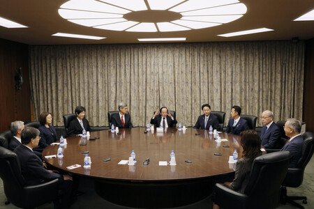 The Bank of Japan's Policy Board holds a monetary policy meeting at the central bank's head office in Tokyo on Friday. (Pool photo)