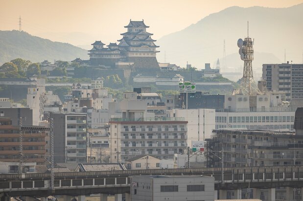 The viewing platform at Tegarayama Central Park offers a distinct perspective of Himeji Castle set amid the surrounding cityscape.