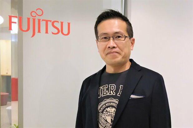 さまざまな困難に直面しつつも、画期的なシステムの開発を成し遂げた、富士通スポーツビジネス統括部統括部長の藤原英則氏
