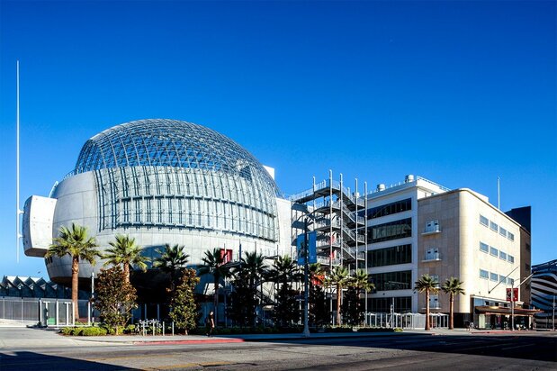 The Saban Building at right is joined by a futuristic dome extension. (Photo by Joshua White/© Academy Museum Foundation)