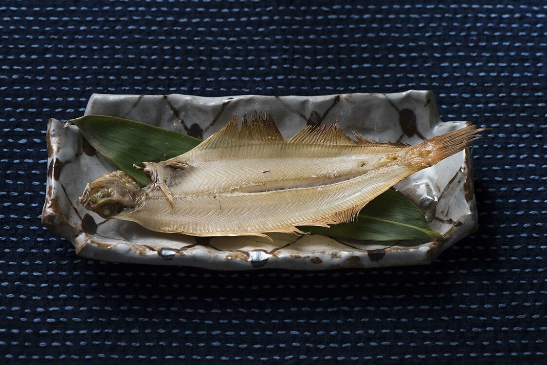 The flounder is caught in nearby coastal waters and air-dried overnight.
