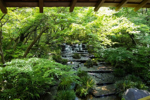 Water cascades next to the covered passage winding through Kōkoen’s Garden of the Lord’s Residence.