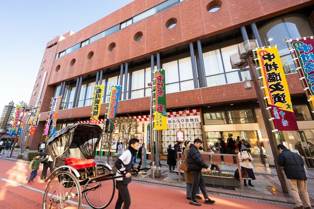 The Asakusa Public Hall, decorated festively with banners advertising the kabuki shows and their performers. (© Nippon.com)