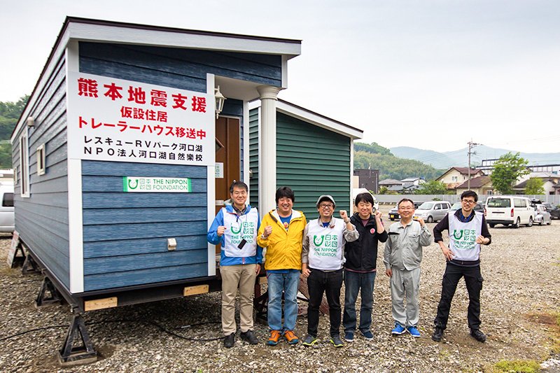 NSK specialists outside their trailer house office.