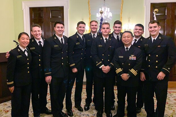 Maeyama stands with midshipmen scheduled for assignments in Japan.