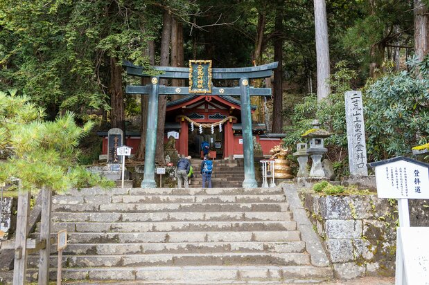 The trailhead leading to the Okunomiya. Climbers, most of whom are well equipped for the mountains, pay a ¥1,000 fee to enter the Mount Nantai trail.