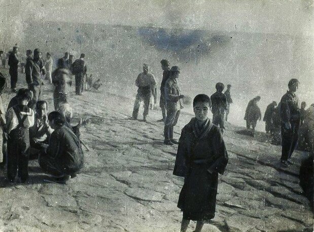 A boy waits forlornly to be repatriated to Japan. Orphaned and alone, the boy was not allowed to board a ship because he had no papers to prove his identity. This photograph is believed to have been taken in Busan in 1946. (Courtesy of Memorial Museum for Soldiers, Detainees in Siberia, and Postwar Repatriates)