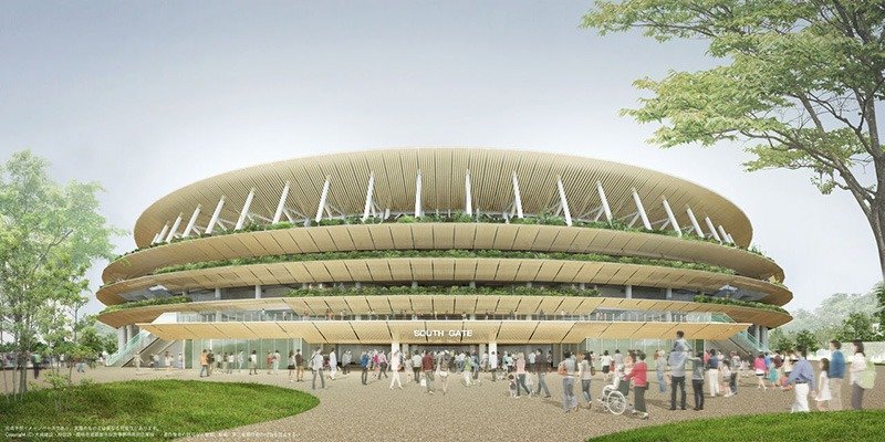 Perspectiva exterior desde la Puerta Sur, que nos da una idea del carácter que le imprimen al estadio los aleros y tejadillos de madera. (Fotografía cortesía de la empresa creada entre la constructora Taisei, el estudio Azusa Sekkei, Kengo Kuma y Asociados, y servida por el JSC).