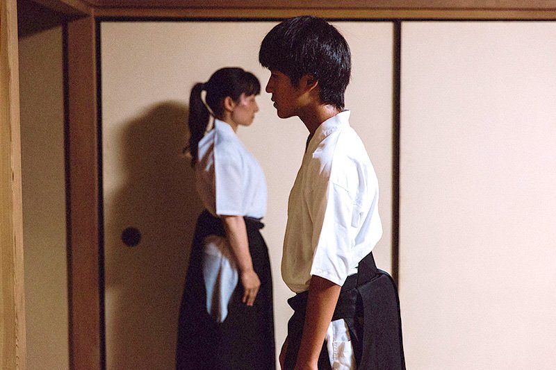 Students in the Ogasawara-ryū school practice standing and walking as part of etiquette training.