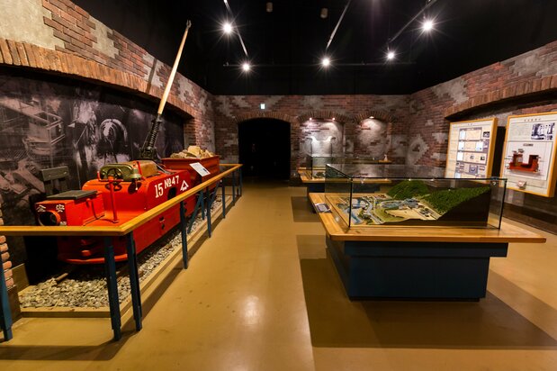 An exhibit inside the mine displays a model of the mine’s copper smelter and the first electric trolley.