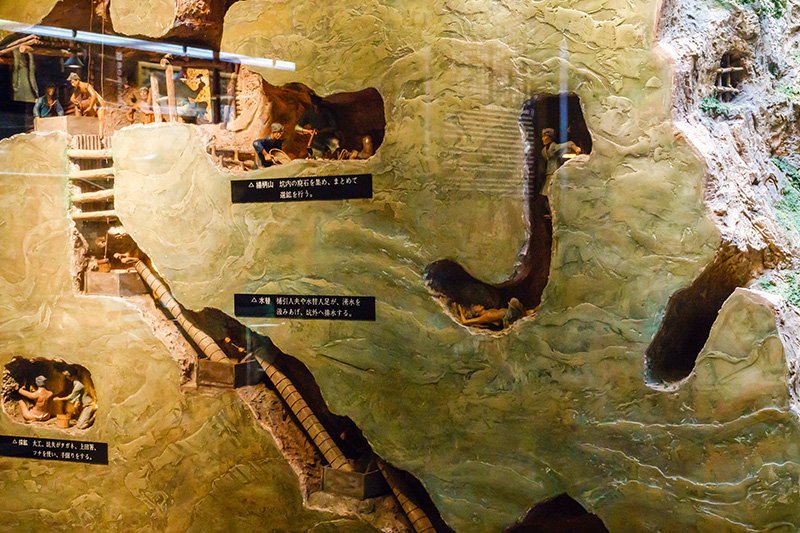 A display shows the snaking tunnels miners carved through the mountain in pursuit of gold and silver.