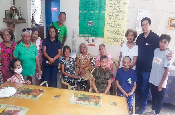 Group home residents, a visiting doctor, and COPAP/COSE members.