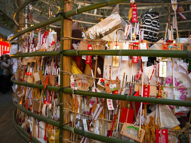 The fire pot is filled with old scrolls and charms brought by visitors to be burned.